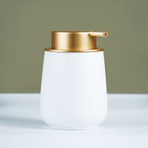 Elegant White Soap Dispenser with Gold Accents